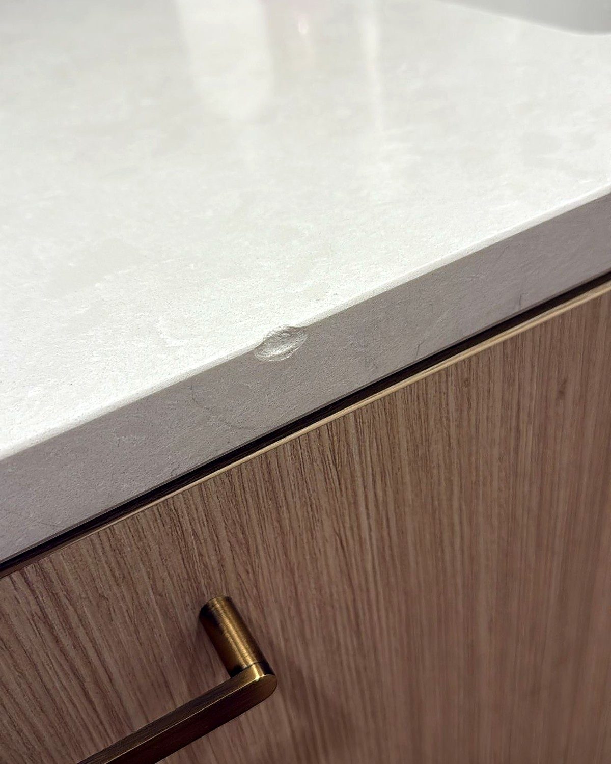 Before: damaged quartz countertop edge
