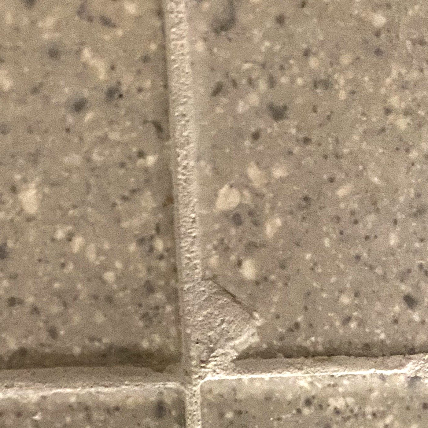 Before: damaged chipped wall tile