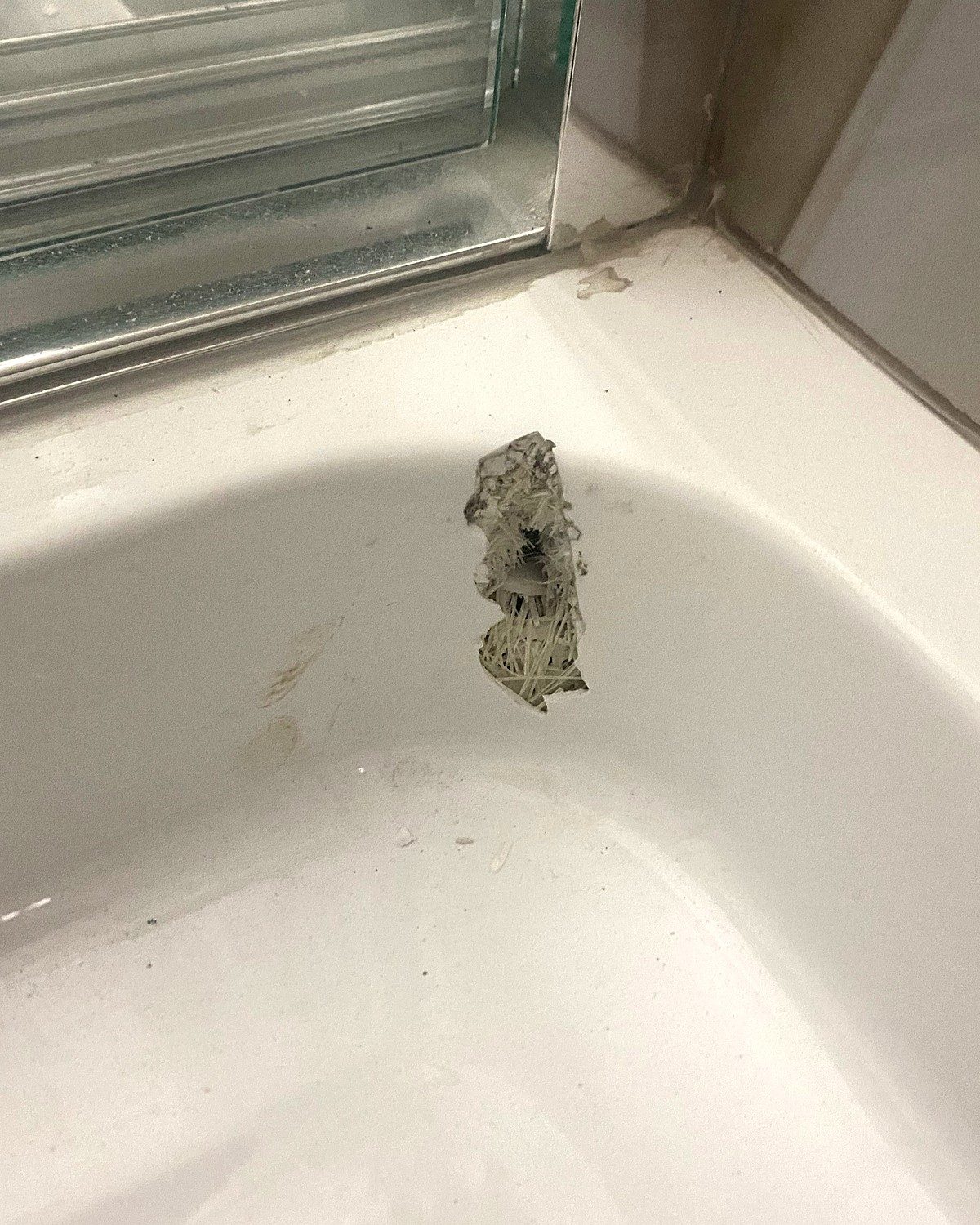 Before: damaged bathtub with an impact chip