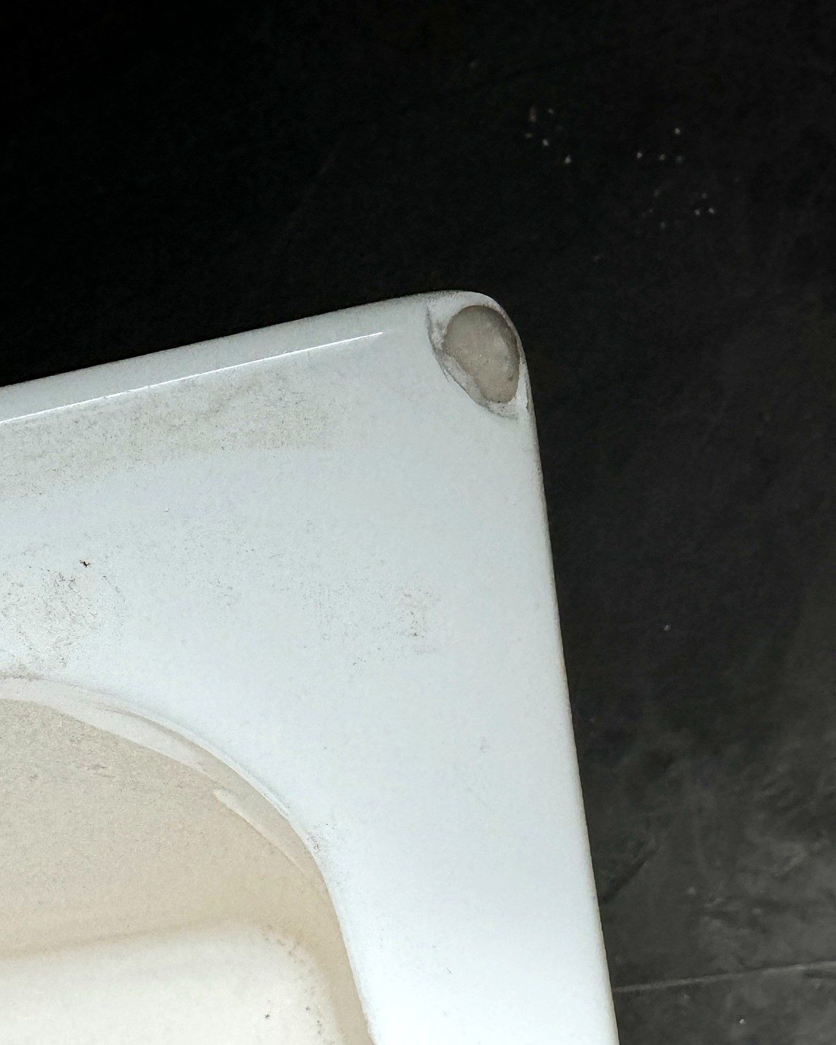 Before: damaged chipped bathtub corner