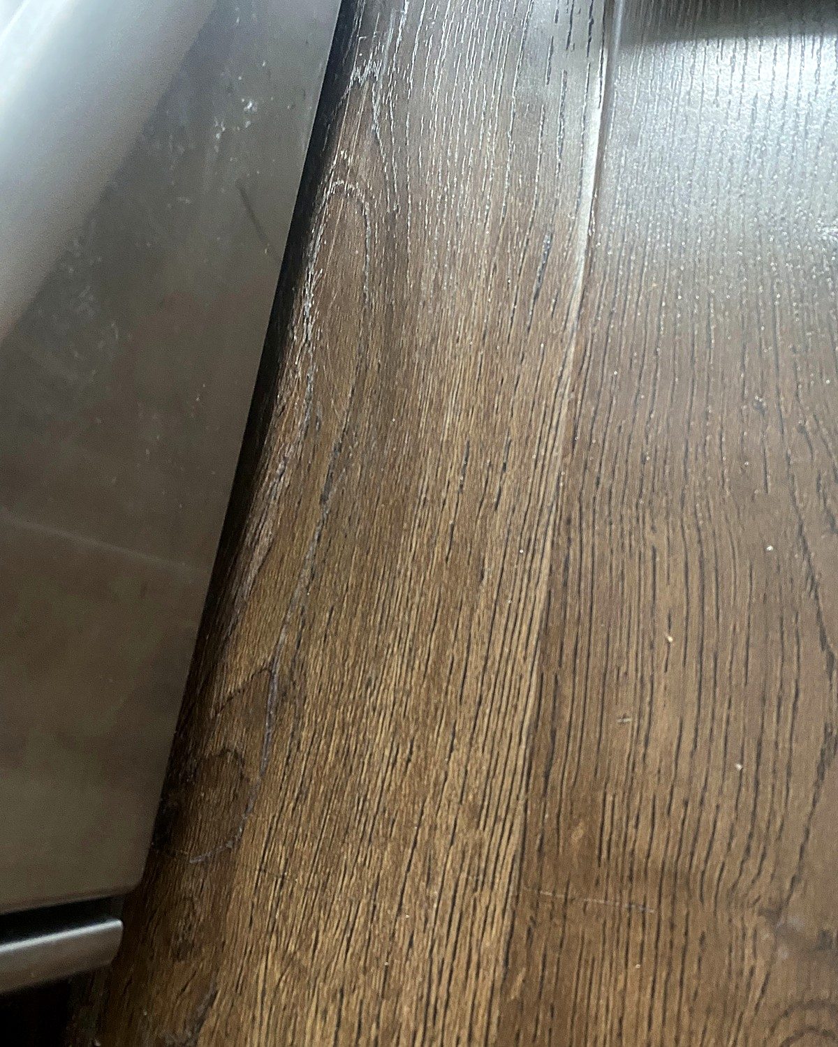 After: scratched wood panel repaired