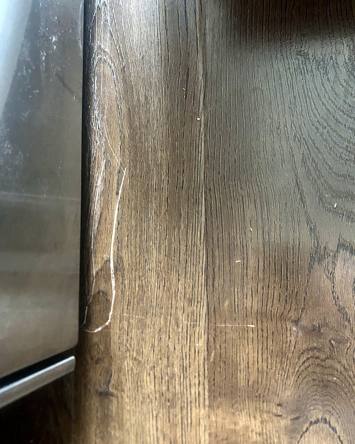 Before: damaged scratched wood panel