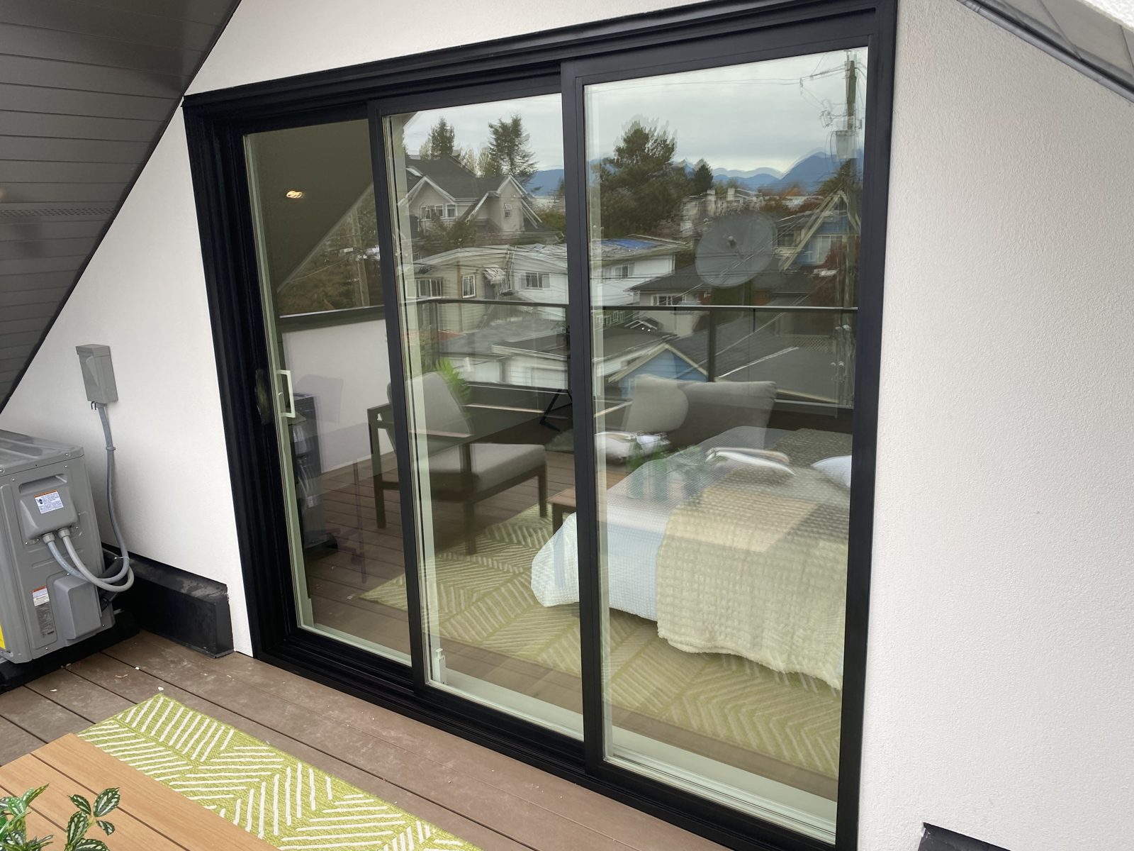 The same sliding door after refinishing, frames restored to an even black